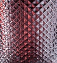 Rhombus pattern on red glass