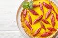 Rhubarb Custard Pie is a decadent dessert perfect for a sweet summer treat closeup on the plate. Horizontal top view