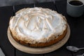 Rhubarb meringue pie. Meringue pie on a wooden table Royalty Free Stock Photo