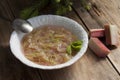 Rhubarb soup with spruce shoots in a plate