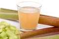 Rhubard juice with stalks and chopped rhubarb Royalty Free Stock Photo