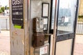 dirty old coin operated public telephone box rusty and disused Royalty Free Stock Photo