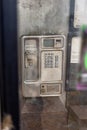 dirty old coin operated public telephone box rusty and disused Royalty Free Stock Photo
