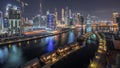 The rhythm of the city of Dubai near canal at night aerial timelapse Royalty Free Stock Photo