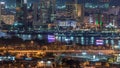 The rhythm of the city at night. View of skyscrapers and canal in Dubai near canal aerial timelapse Royalty Free Stock Photo