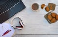 Worktable in call center. Headphones, keyboard and notebook on background top view.