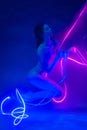 Rhythmic gymnast dancing underwater with neon ribbons. Free diving. Soft focus. Artistic Royalty Free Stock Photo