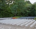 White and gray easy chairs in the Park before the summer stage
