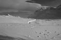 The RhÃÂ¤tische Railyway mÃÂ¤anders in the deep snow of the swiss alps at Bernina Pass Royalty Free Stock Photo