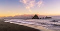 Rialto Beach at dusk with sea stacks covered with clouds coming from the ocean, Olympic National Park, Washington state Royalty Free Stock Photo