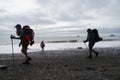 Backpacker walking on Rialto Beach Olympic National Washington