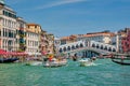 Rialto bridge with boats and gondolas. Grand Canal, Venice, Italy Royalty Free Stock Photo