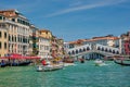 Rialto bridge with boats and gondolas. Grand Canal, Venice, Italy Royalty Free Stock Photo