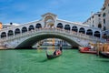 Rialto bridge with boats and gondolas. Grand Canal, Venice, Italy Royalty Free Stock Photo