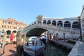 Rialto Bridge at Grand Canal with boats and tourists in Venice, Italy Royalty Free Stock Photo
