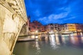 Rialto Bridge at night with city restaurants along grand canal, Venice, Italy Royalty Free Stock Photo