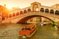 Rialto Bridge over the Grand Canal at sunset, Venice, Italy. It is a famous landmark of Venice Royalty Free Stock Photo