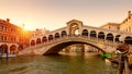 Rialto Bridge over the Grand Canal at sunset, Venice, Italy. It is a famous landmark of Venice Royalty Free Stock Photo