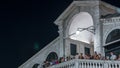 Rialto Bridge or Ponte di Rialto over Grand Canal timelapse at night in Venice, Italy. Royalty Free Stock Photo