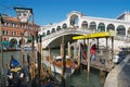 Taxi post next to the landmark Ponte di Rialto bridge over the Grand Canal in Venice, Italy. Royalty Free Stock Photo