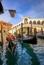 Rialto bridge in Venice, Italy. Venice Grand Canal. Architecture and landmarks of Venice. Venice postcard with Venice gondolas Royalty Free Stock Photo