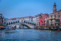Rialto and ornate Gondolas in Grand Canal pier at sunset, Venice, Italy Royalty Free Stock Photo