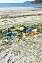 Beach with plastic pollution on sand at famous Rias Baixas Region. Galicia, Spain. Royalty Free Stock Photo