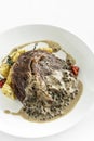 Rib eye steak with creamy peppercorn sauce Royalty Free Stock Photo