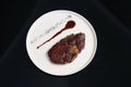 Rib eye steak on white plate, close-up. Sliced tenderloin steak Royalty Free Stock Photo