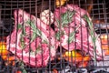 Rib eye steaks and grill with burning fire. Royalty Free Stock Photo