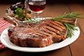 rib-eye veal chop with grill marks on a platter Royalty Free Stock Photo