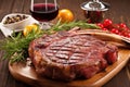 rib-eye veal chop with grill marks on a platter Royalty Free Stock Photo