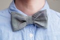 Ribbed black and white bow tie on a woman`s neck