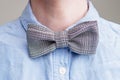 Ribbed black and white bow tie on a woman`s neck