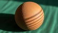 Ribbed pattern on the sphere suggesting a light source at an angle enhancing Royalty Free Stock Photo