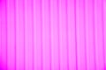 Ribbed wall of the shipping container. Pink corrugated metal sheet useful as a background, horizontal image. Royalty Free Stock Photo