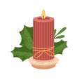 Ribbed wax candle on candlestick with leaf. Modern eco decoration. Decorative glowing candlelight taper with flame. Cosy