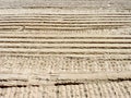 Ribbed wheel tracks on dry sand. Royalty Free Stock Photo