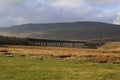 Ribblehead Viaduct under the brooding mass of Wernside, Yorkshires highest peak