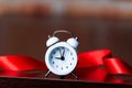 Ribbon and little alarm clock Royalty Free Stock Photo
