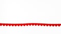 A ribbon made of small red hearts on a white background. Royalty Free Stock Photo