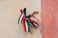 Ribbon with national colours of Hungary tied up to the oldcastle wall in Mukachevo, Ukraine. Independance day concept.