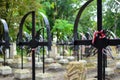 Ribbon with national colours of Poland tied up to the old cross on the cemetery. All saints day concept.