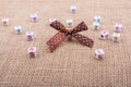 A ribbon and scattered dice-sized alphabet cubes on a textured s Royalty Free Stock Photo