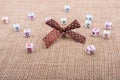 A ribbon and scattered dice-sized alphabet cubes on a textured surface Royalty Free Stock Photo