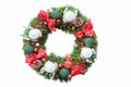 With ribbons, baubles and candles decorated evergreen yew wreath Royalty Free Stock Photo