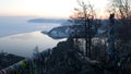 Ribbons for good luck tied on the observation platform of the Chersky stone in Listvyanka. View of Angara river and Baikal. Sunset Royalty Free Stock Photo