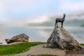 View at the Statue of Golderhorn Zlatorogin Morning haze near Lake Bohinj in Ribcev Laz village - Slovenia