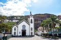 Ribeira Brava, Madeira, Portugal - Sep 9, 2019: Beautiful Roman Catholic Church in the city center. Palm trees on the square. Royalty Free Stock Photo