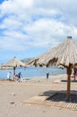 Ribeira Brava, Madeira, Portugal - Sep 9, 2019: Sandy beach in the Madeiran vacation destination. Sunbeds and umbrellas, people on